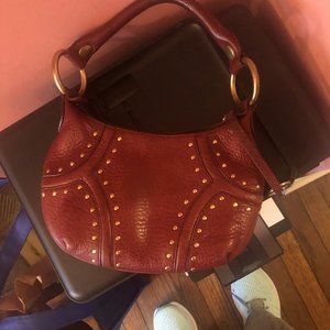 Leather bag, dark magenta color, studded design!
